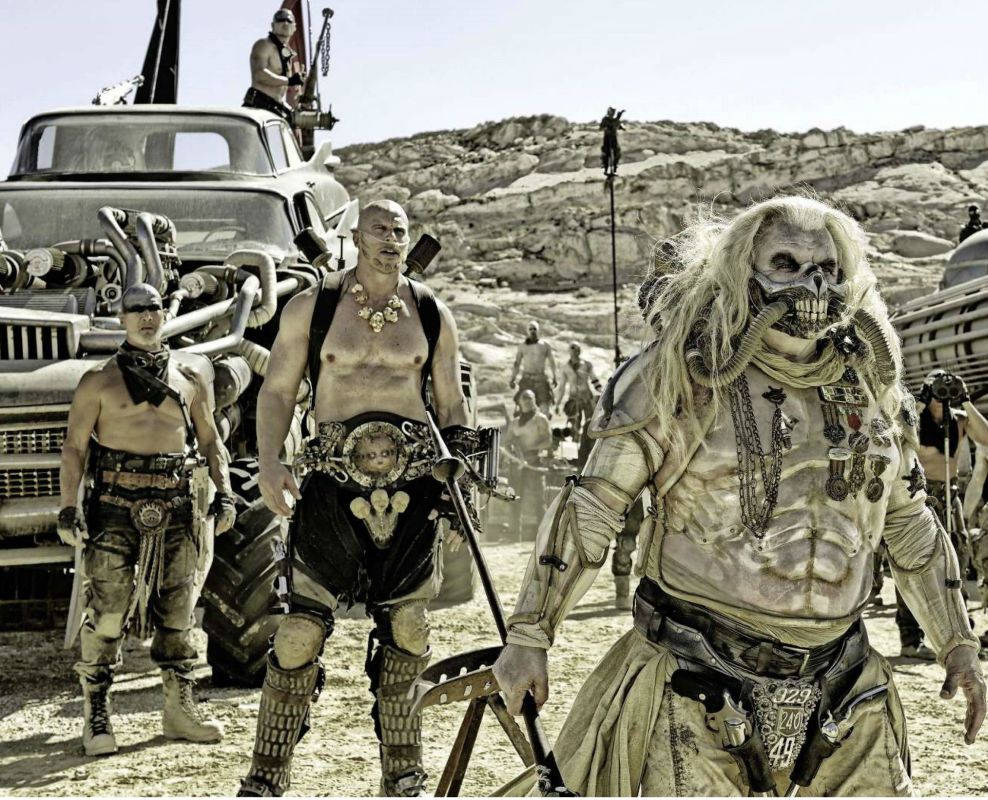 The villains: Immortan Joe (Hugh Keays-Bryne) and his soldiers. Photo Credit: Warner Bros.