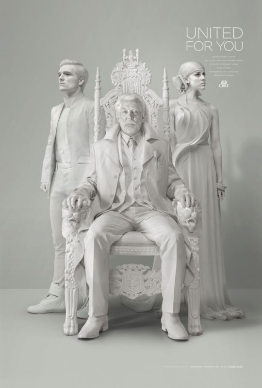 One of Mockingjay Part 1 posters depicting the iron first of the Capitol. Photo Credit: Lionsgate.