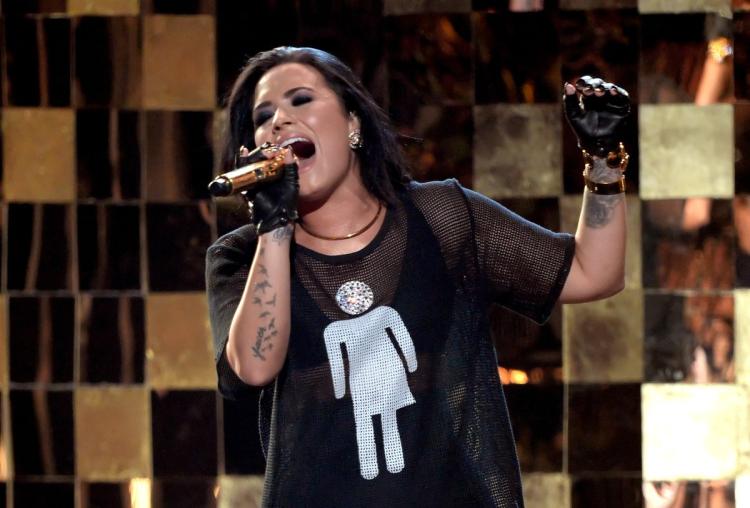 Demi Lovato performs onstage with a shirt bearing a transgender rights symbol during the 2016 Billboard Music Awards Sunday night. (KEVIN WINTER/GETTY IMAGES)