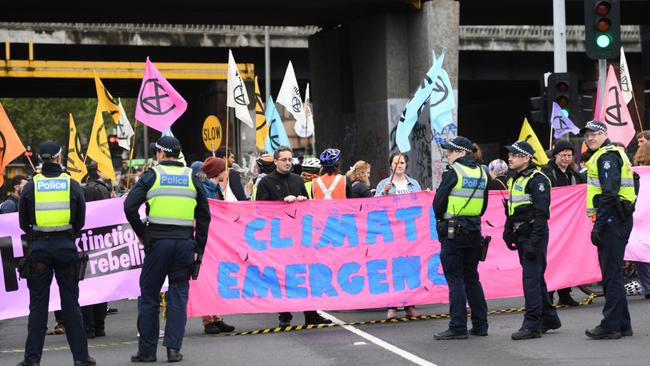 Climate change protester disrupts Louis Vuitton show in Paris